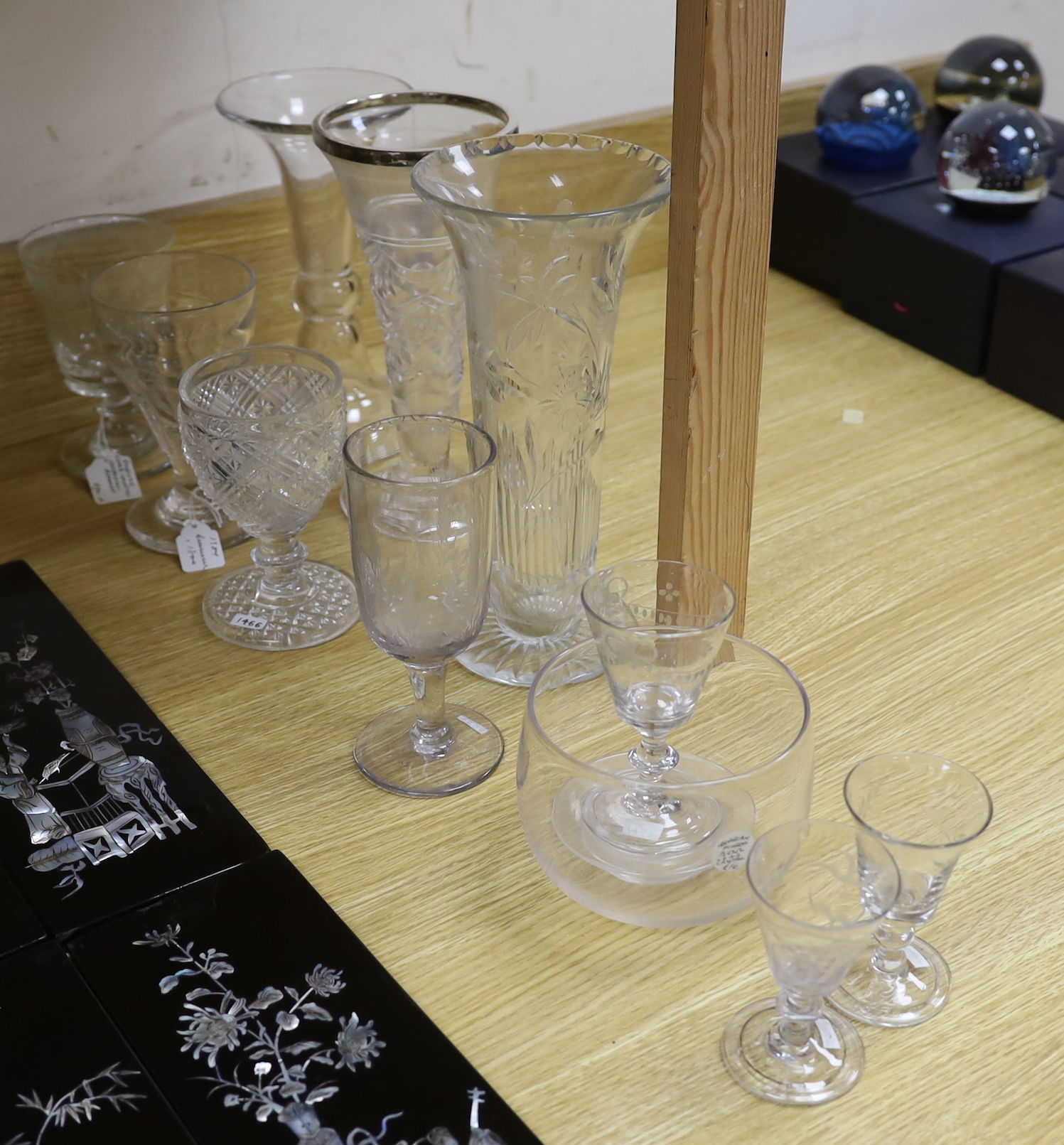 A collection of 18th and 19th century drinking glasses, etc. including rummers, engraved sherry glasses with knobbed stems, folded feet and broken pontils, a cut glass goblet, a Georgian finger bowl and stand, two vases,